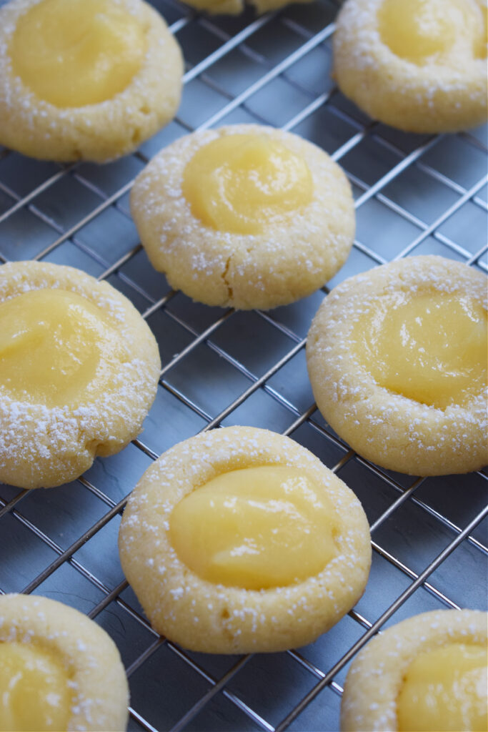 Lemon curd cookies on a tray.