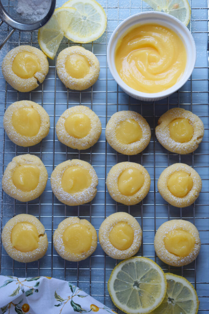 Lemon curd cookies on a baking tray.