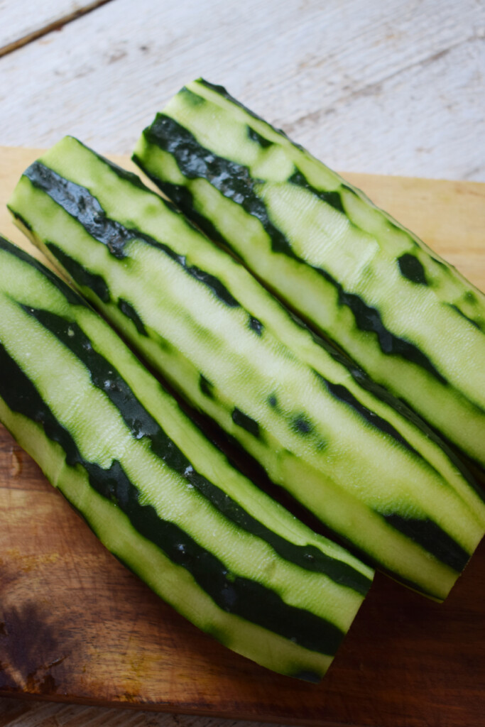 Cucumbers on a wooden board.