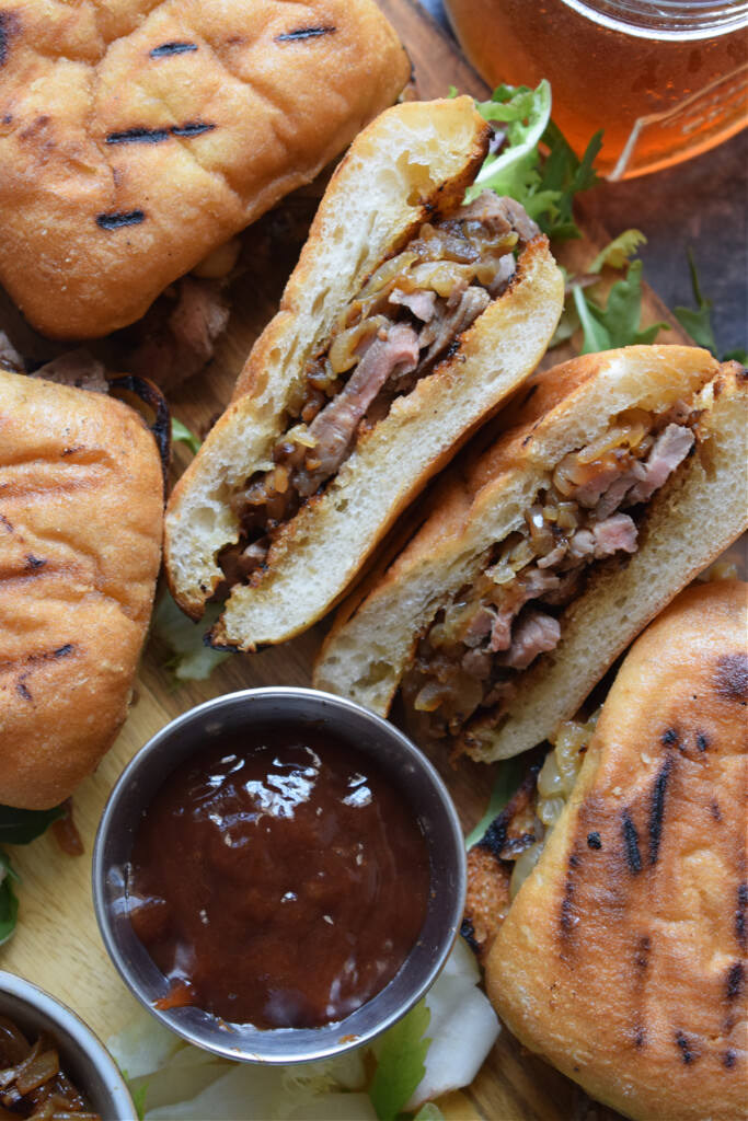 Shaved steak sandwiches with barbecue sauce.