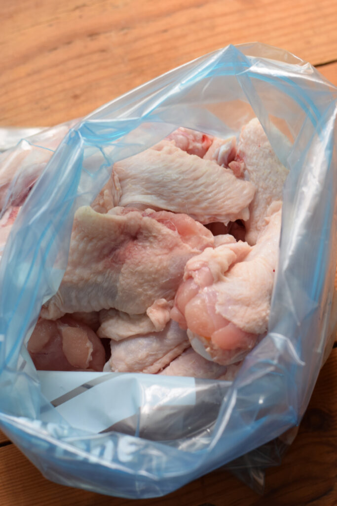 Chicken wings in a ziplock bag.