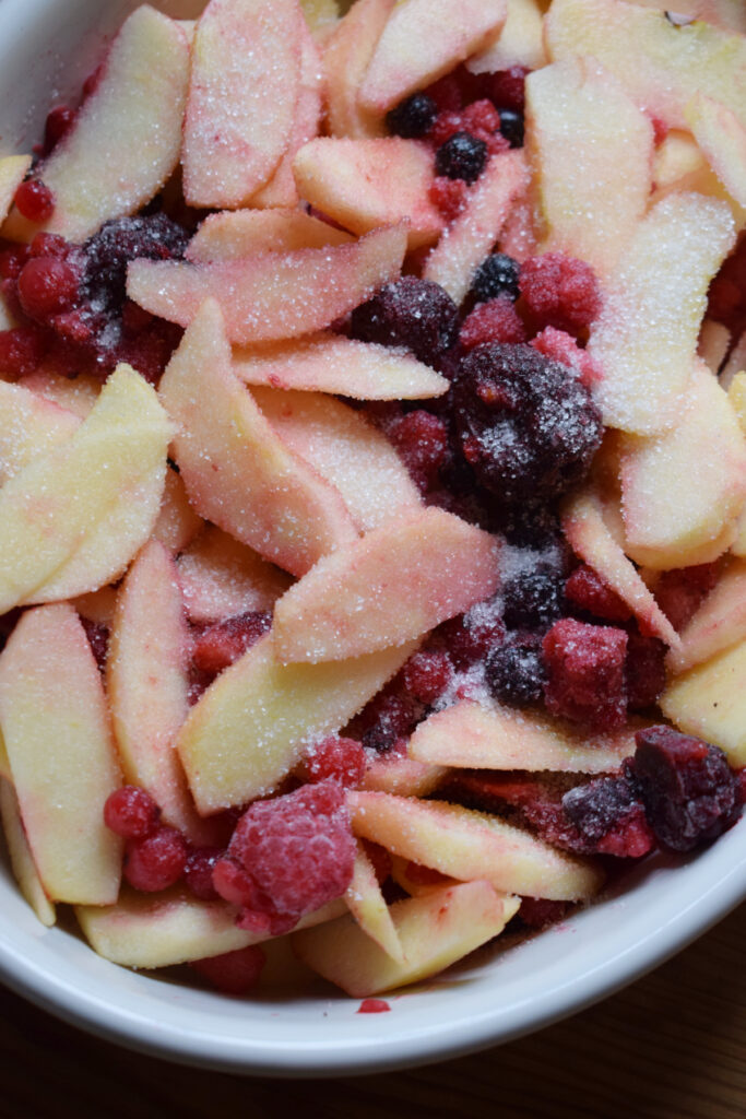 Fruit and berries in a baking dish.