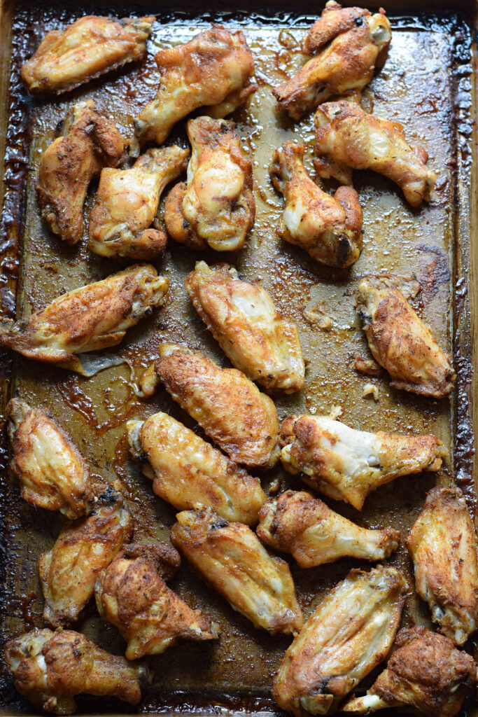 Baked wings on a baking tray.
