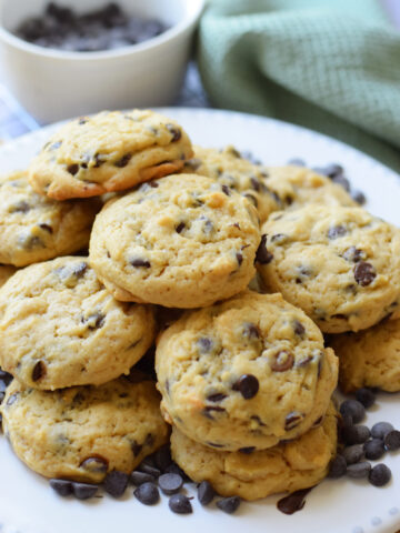 Chocolate chip cream cheese cookies on a plate.