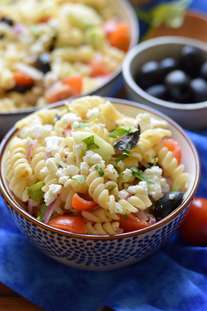 Greek style pasta salad in a bowl.