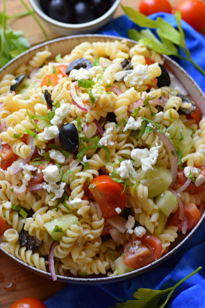 Pasta salad with tomatoes and cucumbers.