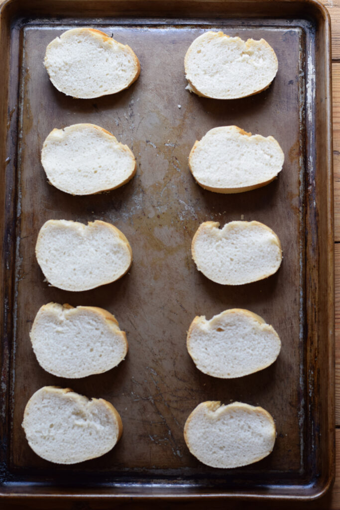 Bread slices on a baking tray.