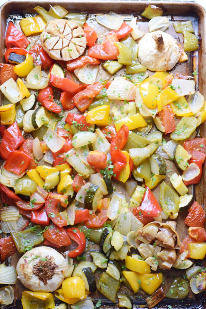 Roasted vegetables on a baking tray.