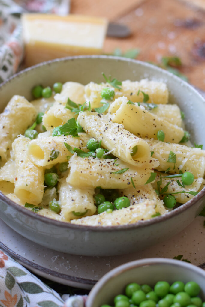 A summer pasta dish in a bowl.