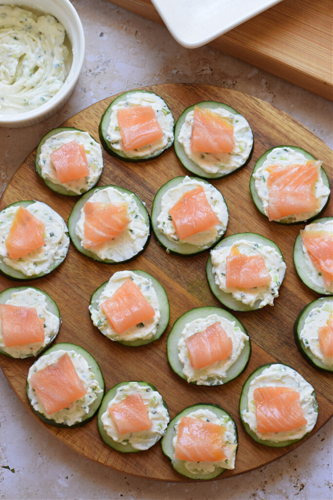 Salmon topped cucumber slices.