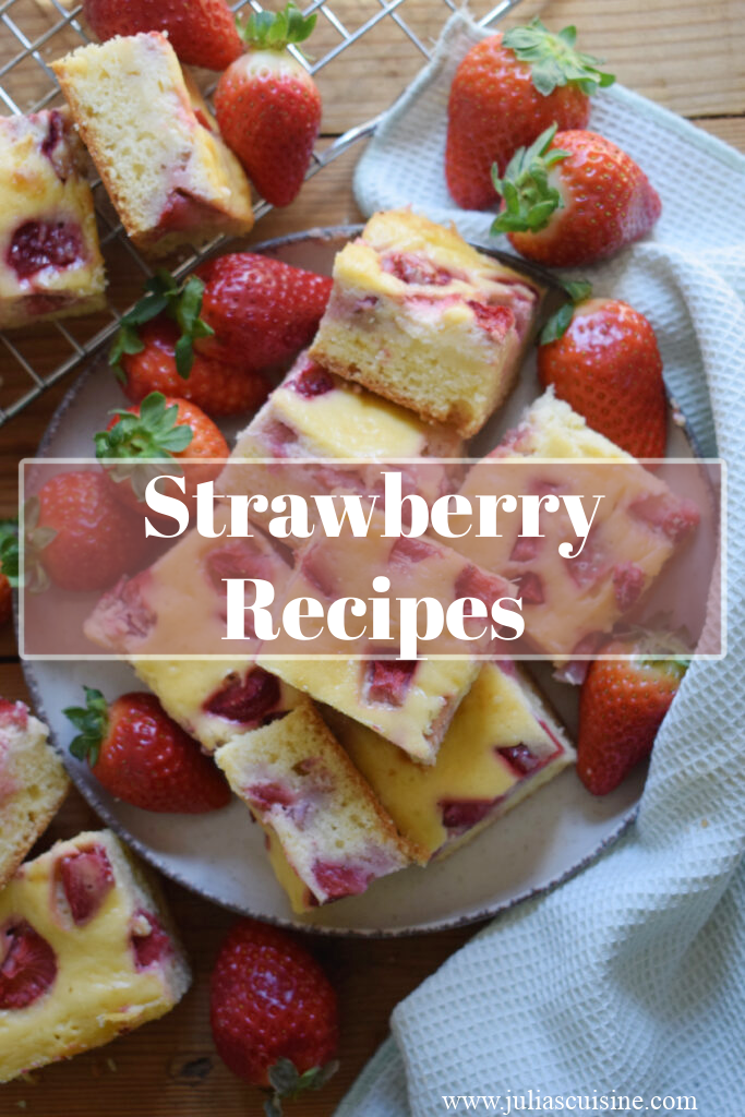 Close up of strawberry cake squares on a plate.