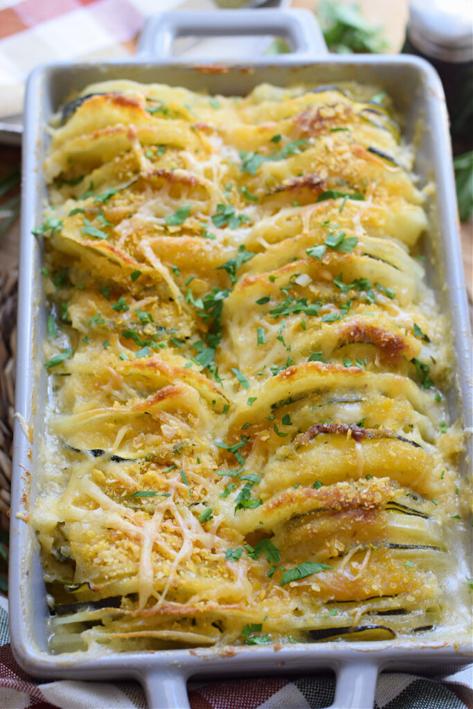 Potato and zucchini bake in a casserole dish.