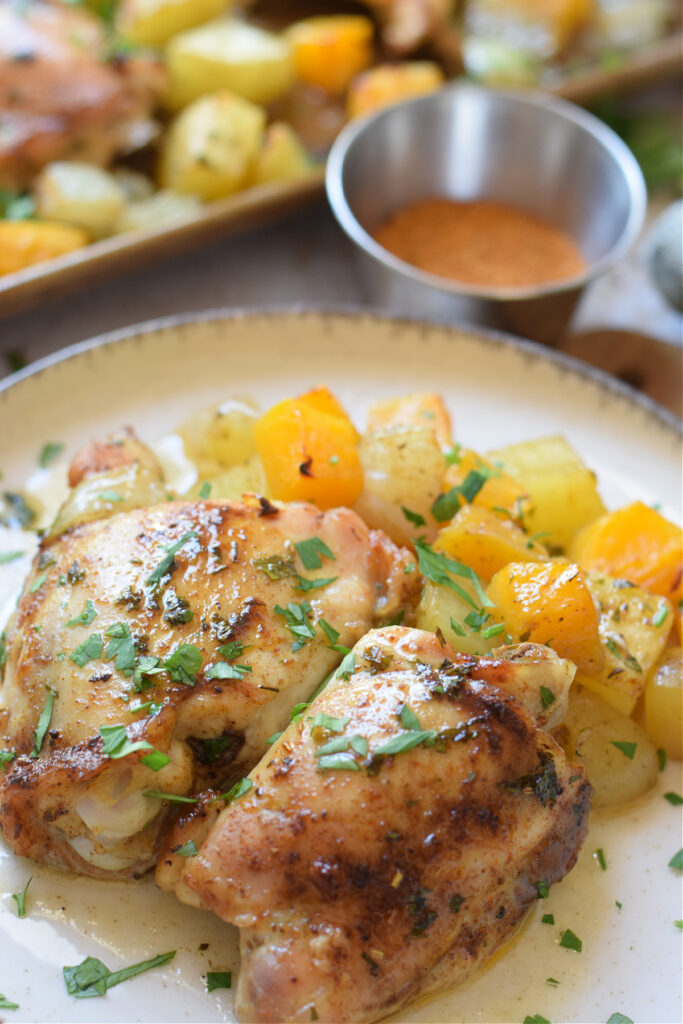 Close up of roasted chicken and squash dinner.