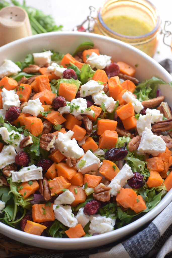 Sweet potato salad with greens in a bowl.