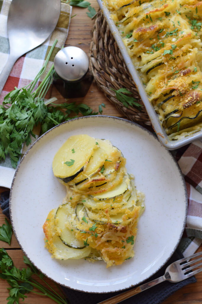 Potato and zucchini gratin on a plate.