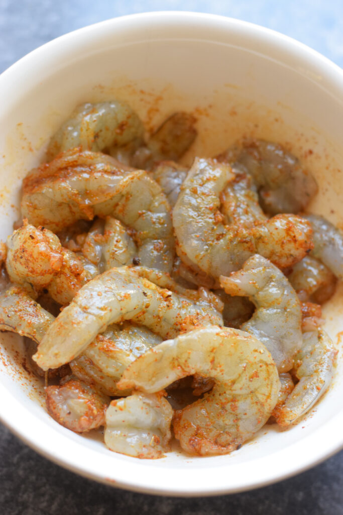 Spiced shrimp in a white bowl.