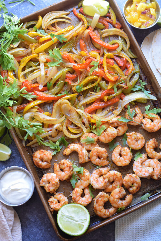 Peppers and shrimp on a baking tray.
