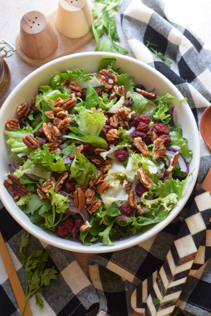 Leafy green salad with pecans.