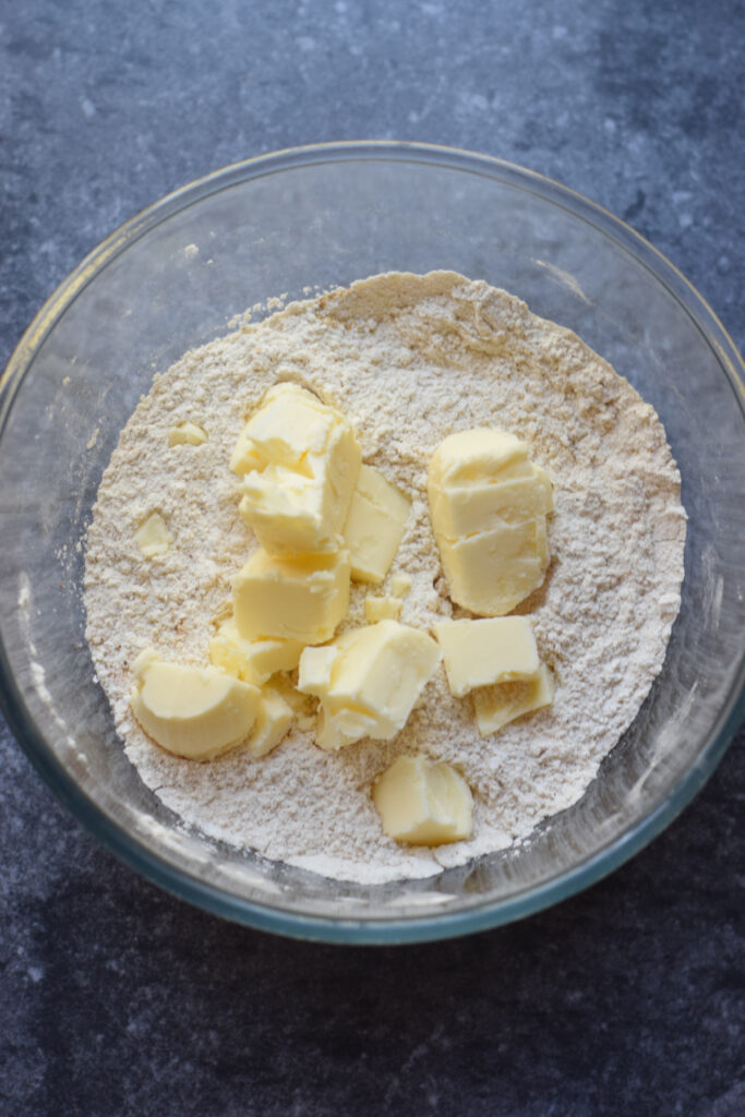 Add butter to dry ingredients.