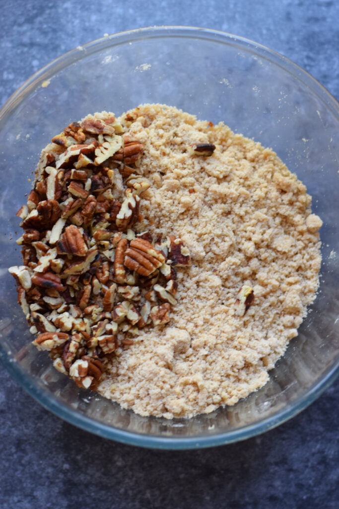 pecans and dry crumble mixture in a bowl.