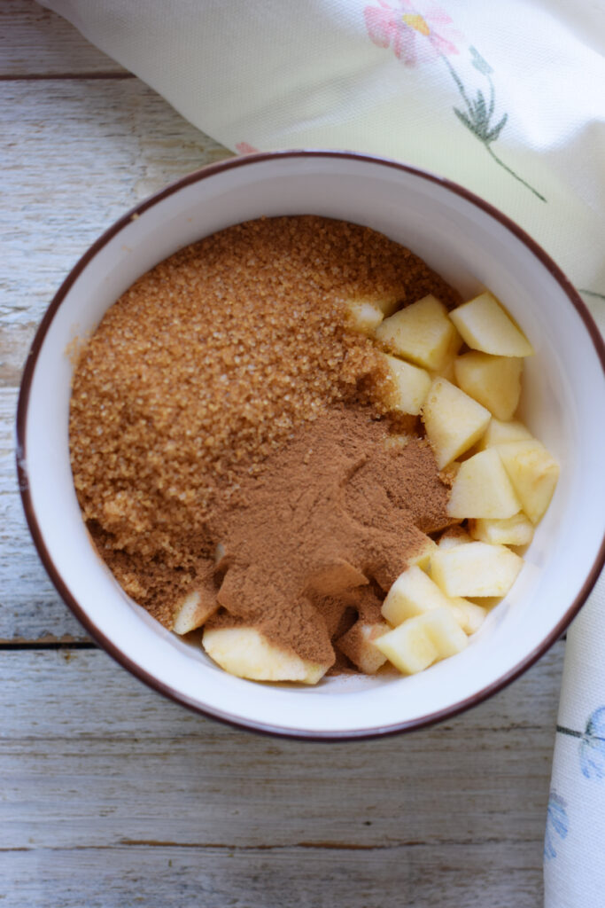 Brown sugar with apples in a bowl.