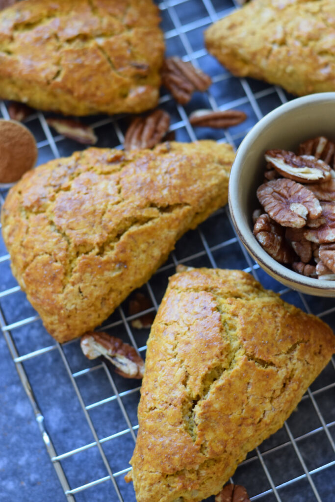 Close up of pumpkin scones on a baking tray.