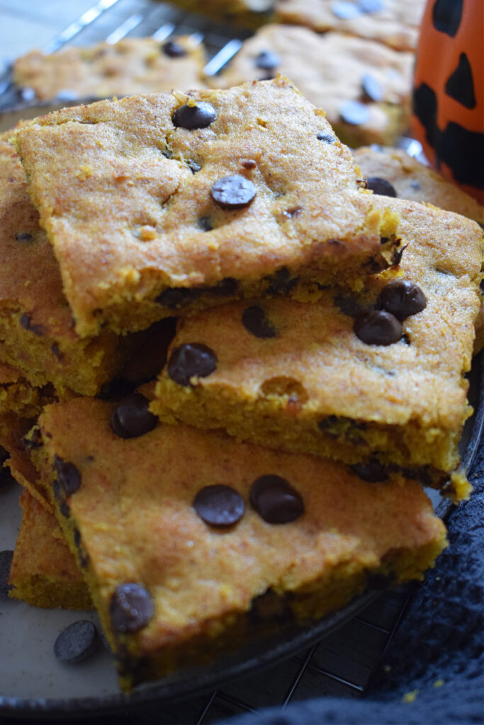 A stack of pumpkin chocolate chip cookie bars.
