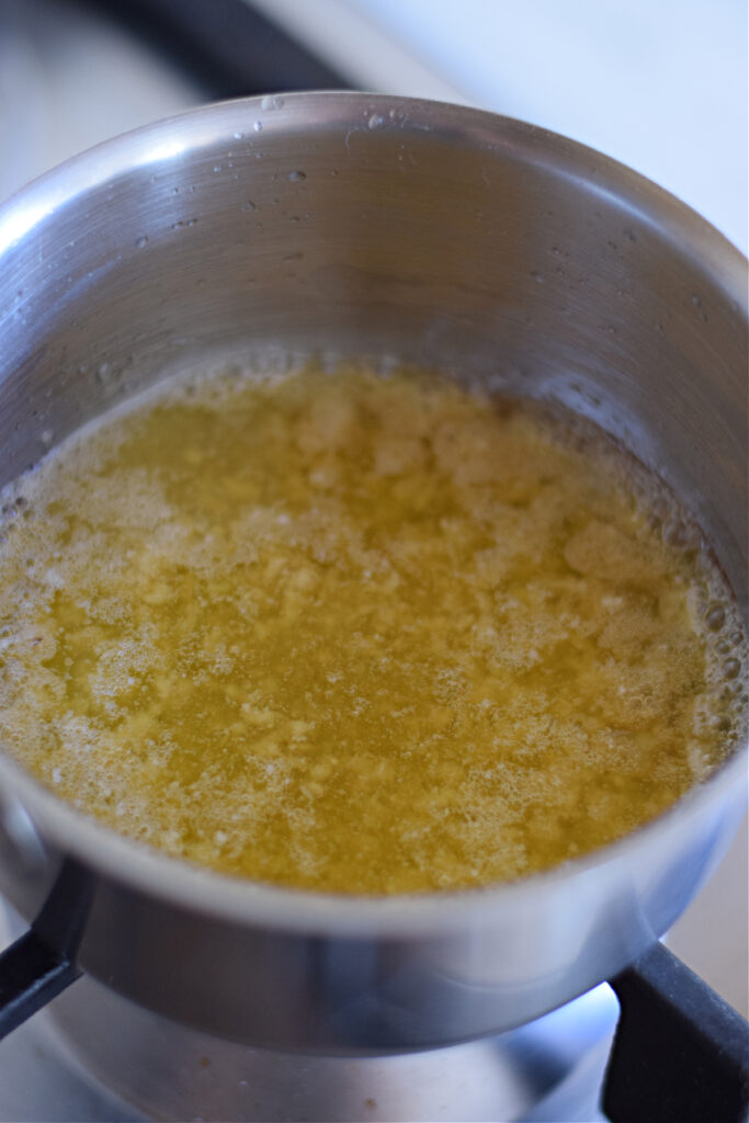 Melted butter and honey in a saucepan.