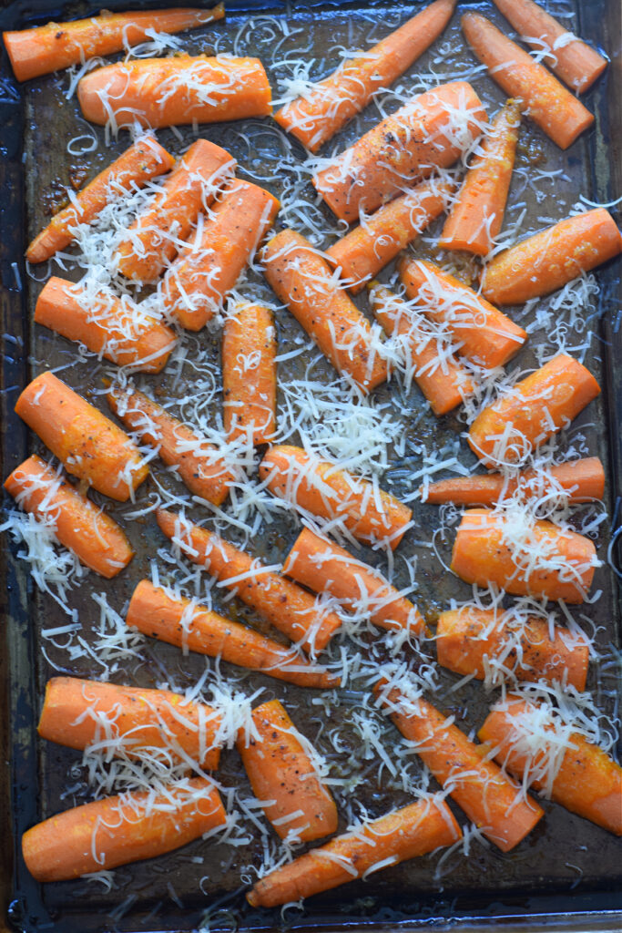Roasted carrots topped with parmesan cheese.