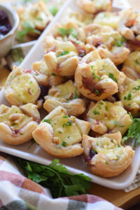 Cranberry Brie Bites on a white plate.