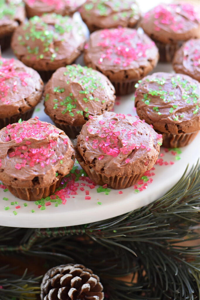 Christmas brownie bites with sprinkles and frosting.