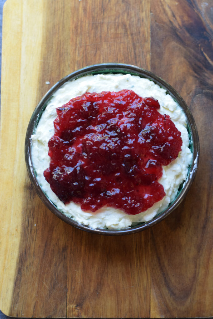 Whipped feta topped with cranberry sauce.