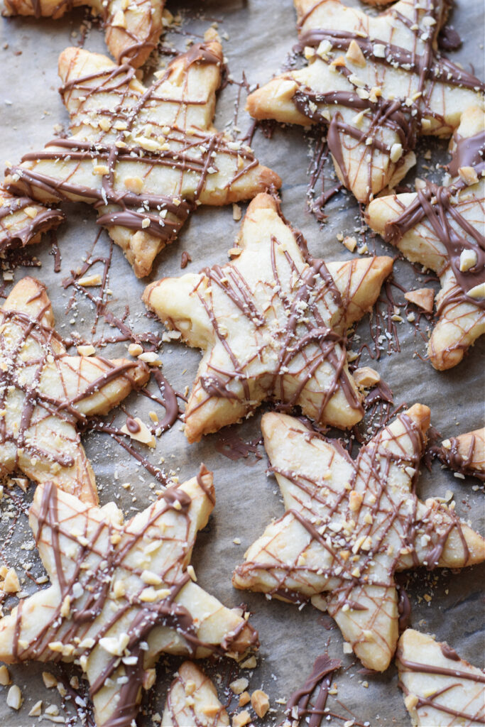 Milk chocolate topped shortbread star cookies.