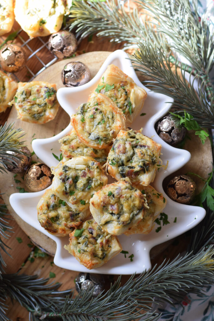 Spinach puffs on a christmas tree plate.
