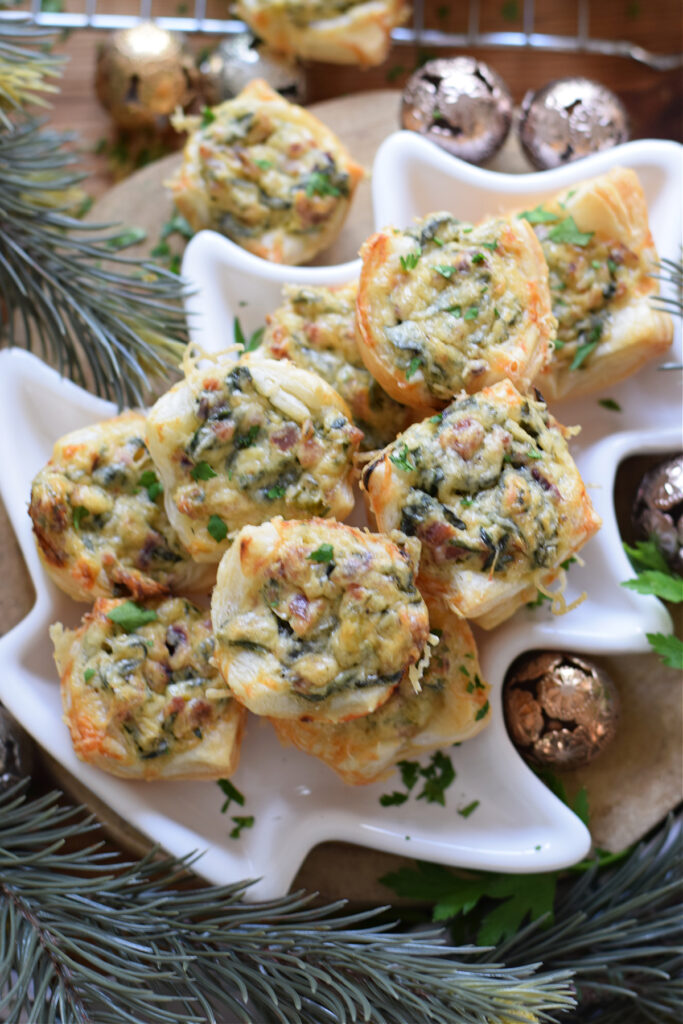 Spinach appetizers on a christmas tree plate.