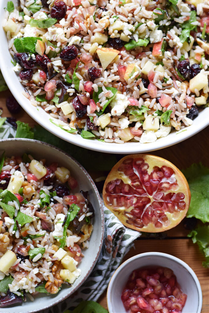 Wild rice salad in a bowl with pomegranates.