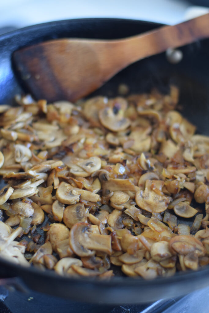 Cooked mushrooms in a skillet.