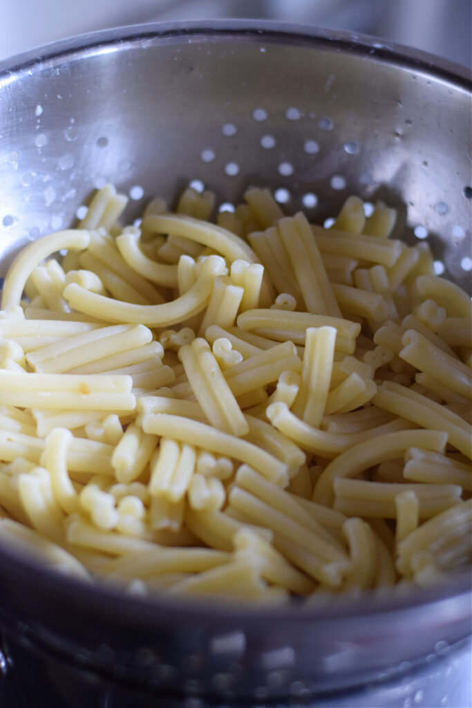 Drained pasta in a colander.