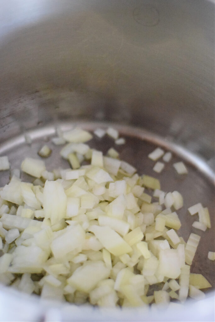 Onions in a pot to make soup.