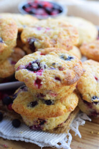 Berry muffins in a stack.