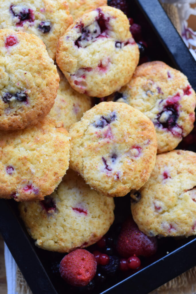 Berry muffins in a baking tray.