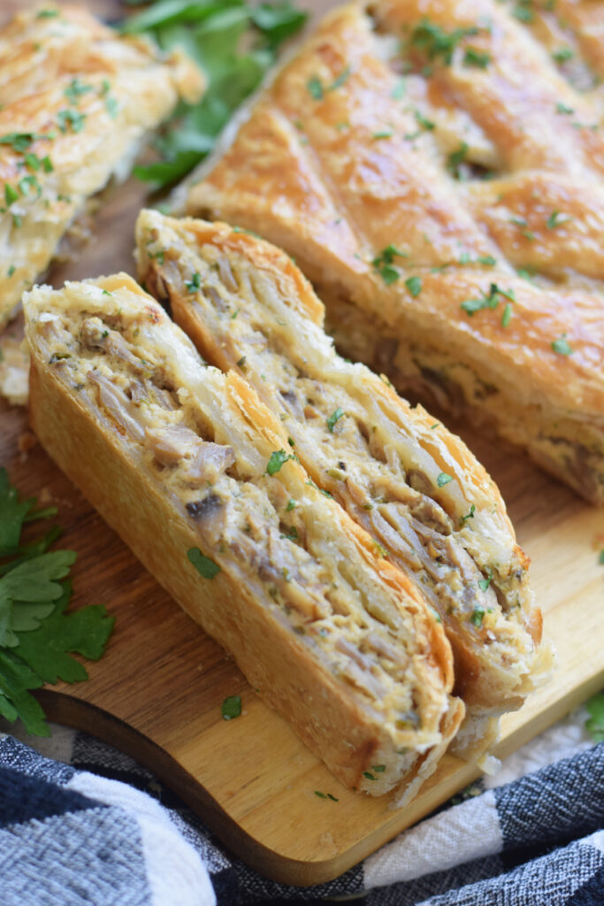 Close up of a mushroom filled puff pastry braid.