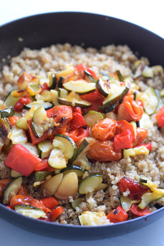 Quinoa and vegetables in a large bowl.