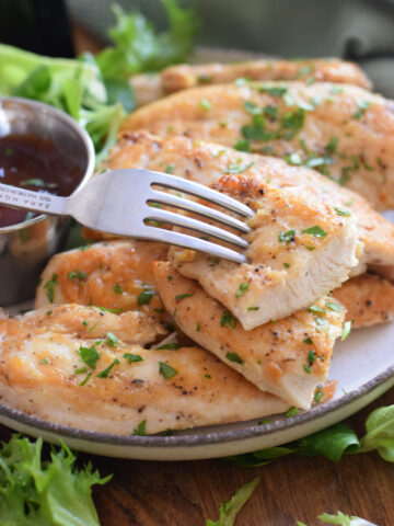 Close up of chicken tenders on a plate.