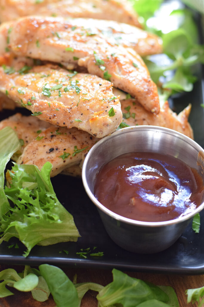 Chicken tenders with dipping sauce.