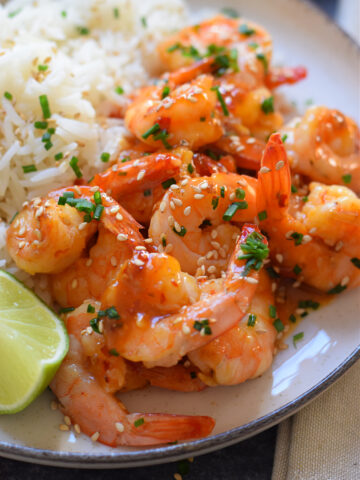 Close up of shrimp on a plate with rice.