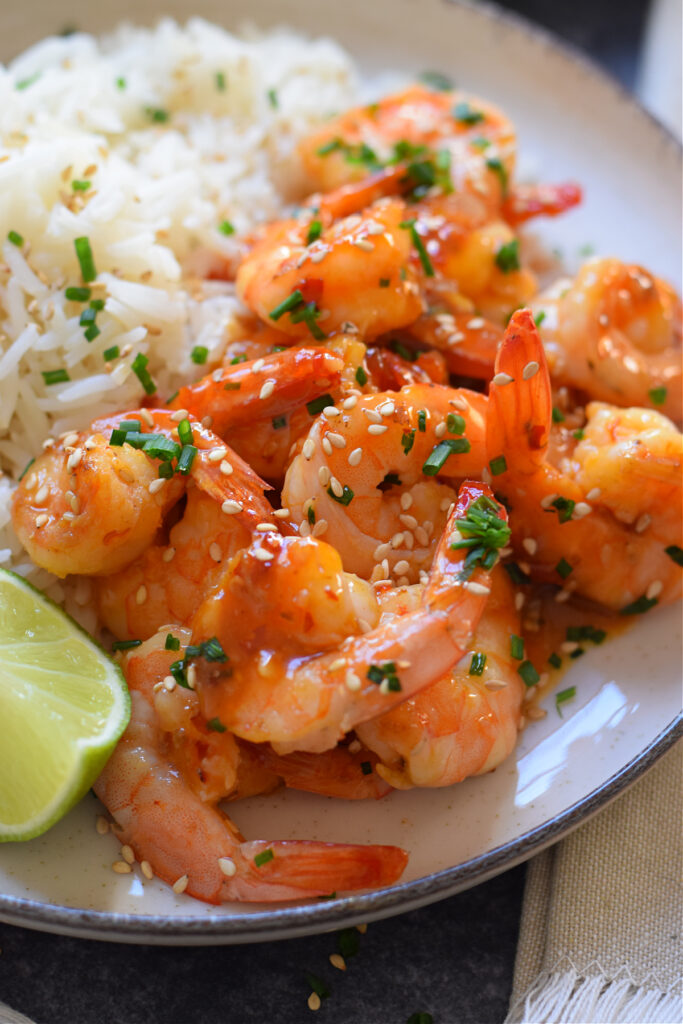 Close up of shrimp on a plate with rice.