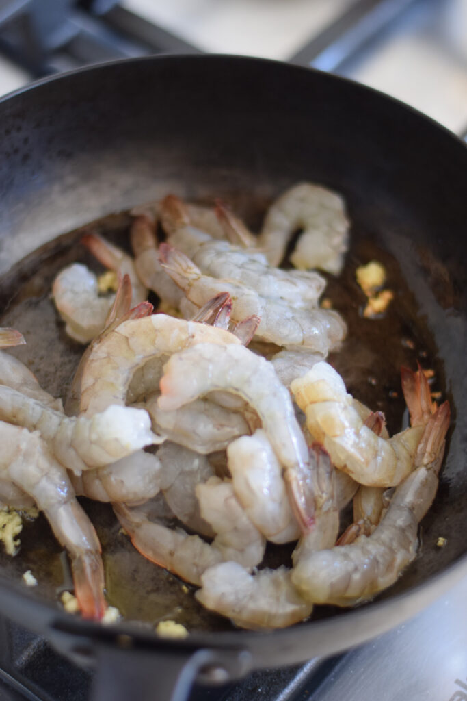 Cooking shrimp in a skillet.