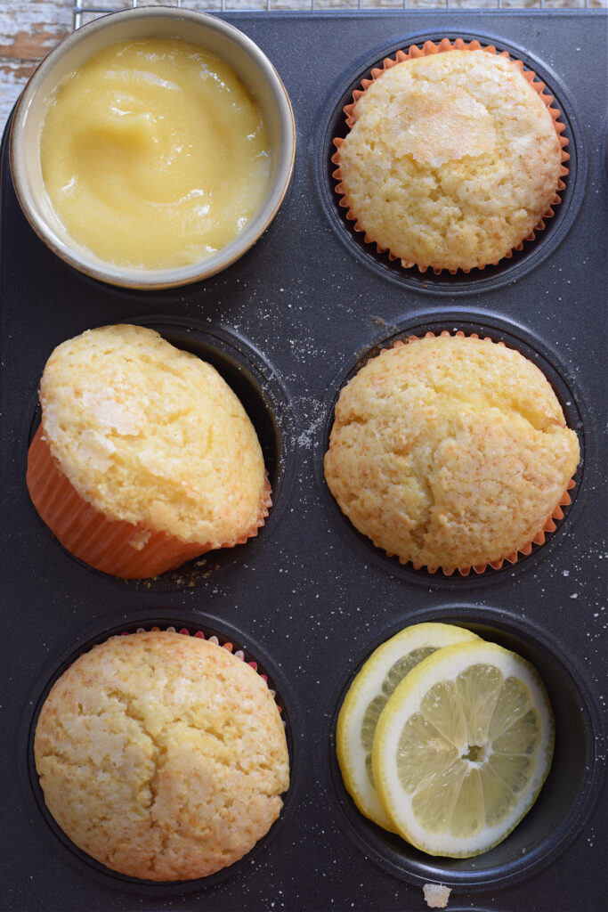Lemon muffins in a baking tray.