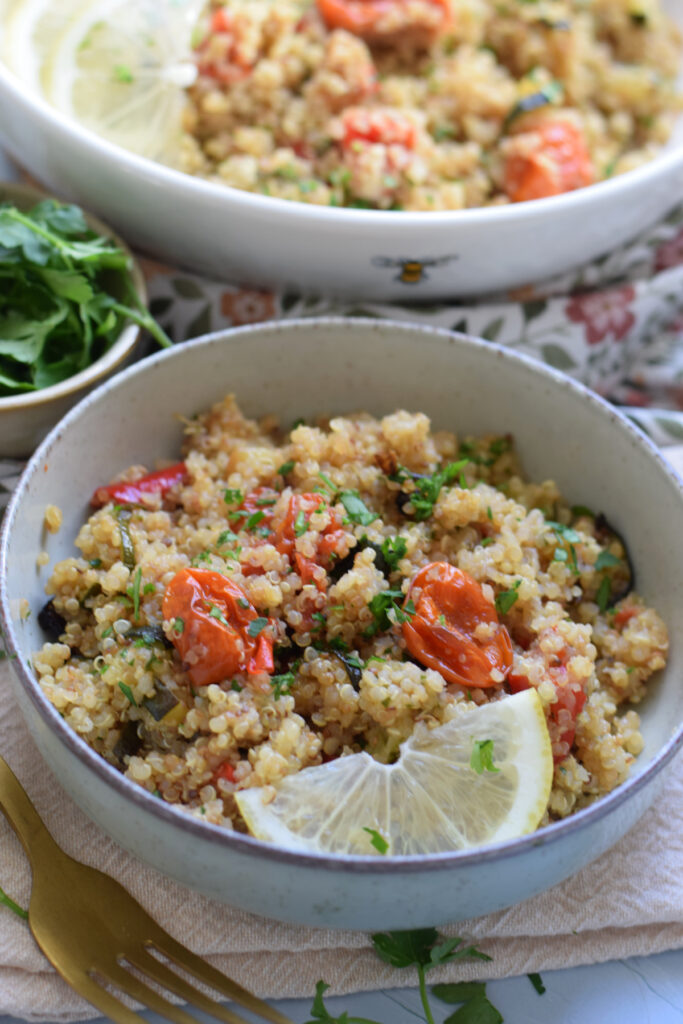 Roasted vegetable quinoa in a small bowl.